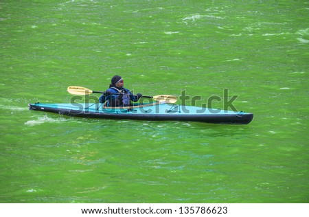 CHICAGO - MARCH 16: The Chicago River is dyed green for St. Patrick\'s Day in Chicago on March 16, 2013