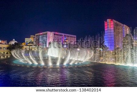 LAS VEGAS - FEB 11: Night view of the dancing fountains of Bellagio and flamingo and Ballys hotels in Las Vegas Nevada, USA on February 11 , 2013