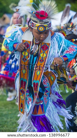 MARIPOSA ,USA - MAY 11 : Unidentified Native Indian boy takes part at the Mariposa 20th annual Pow Wow in California , USA on May 11 2013 ,Pow wow is native American cultural gathernig event.