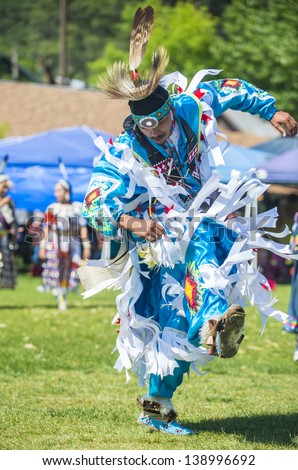 MARIPOSA ,USA - MAY 11 : Unidentified Native Indian man takes part at the Mariposa 20th annual Pow Wow in California , USA on May 11 2013 ,Pow wow is native American cultural gathernig event.