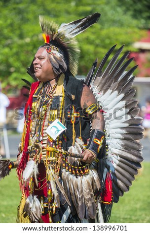 MARIPOSA ,USA - MAY 11 : Unidentified Native Indian man takes part at the Mariposa 20th annual Pow Wow in California , USA on May 11 2013 ,Pow wow is native American cultural gathernig event.