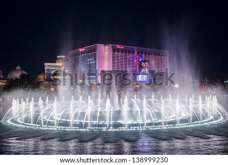 LAS VEGAS - FEB 11: Night view of the dancing fountains of Bellagio and flamingo hotel in Las Vegas Nevada, USA on February 11 , 2013