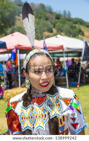MARIPOSA ,USA - MAY 11 : An unidentified Native Indian woman takes part at the Mariposa 20th annual Pow Wow in California , USA on May 11 2013 ,Pow wow is native American cultural gathernig event.