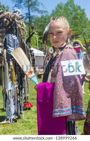 MARIPOSA ,USA - MAY 11 : An unidentified Native Indian girl takes part at the Mariposa 20th annual Pow Wow in California , USA on May 11 2013 ,Pow wow is native American cultural gathernig event.