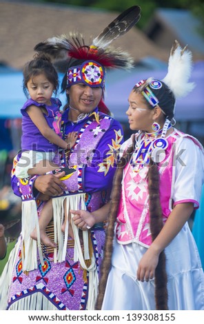 MARIPOSA ,USA - MAY 11 : An unidentified Native Indian family takes part at the Mariposa 20th annual Pow Wow in California , USA on May 11 2013 ,Pow wow is native American cultural gathernig event.