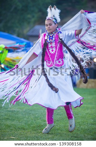 MARIPOSA ,USA - MAY 11 : An unidentified Native Indian dancer takes part at the Mariposa 20th annual Pow Wow in California , USA on May 11 2013 ,Pow wow is native American cultural gathernig event.