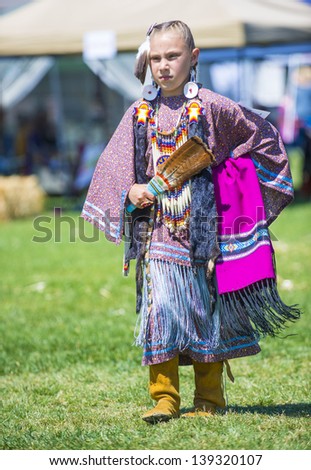 MARIPOSA ,USA - MAY 11 : An unidentified Native Indian girl takes part at the Mariposa 20th annual Pow Wow in California , USA on May 11 2013 ,Pow wow is native American cultural gathernig event.