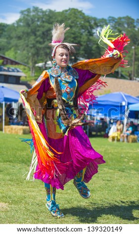 MARIPOSA ,USA - MAY 11 : An unidentified Native Indian dancer takes part at the Mariposa 20th annual Pow Wow in California , USA on May 11 2013 ,Pow wow is native American cultural gathernig event.