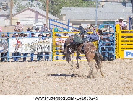 LAS VEGAS - MAY 17 : Cowboy Participant in a Bucking horse Competition at the Helldorado Days Professional Rodeo in Las Vegas , USA on May 17 2013