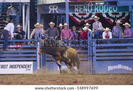 RENO , USA - JUNE 30 : Cowboy Participant in a Bull riding Competition at the Reno Rodeo  a Professional Rodeo held in Reno Nevada , USA on June 30 2013