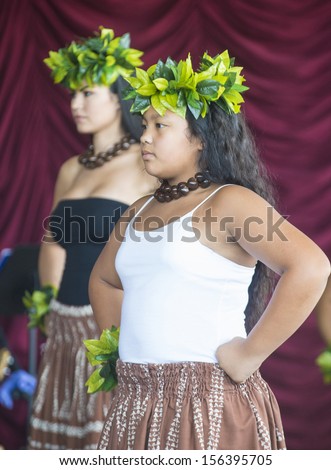 HENDERSON , NEVADA - SEP 15 : Dancer with traditional dress performs Hawaiian dance in the 23rd Annual Hoolaulea Pacific Islands Festival in Henderson Nevada on September 15 , 2013