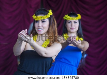 HENDERSON , NEVADA - SEP 15 : Dancers with traditional dress performs Hawaiian dance in the 23rd Annual Hoolaulea Pacific Islands Festival in Henderson Nevada on September 15 , 2013