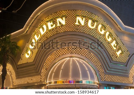 LAS VEGAS -OCT 08 : The Golden Nugget hotel and casino in downtown Las Vegas on October 08 , 2013. Golden Nugget is the largest hotel in the downtown area, with a total of 2,345 rooms.