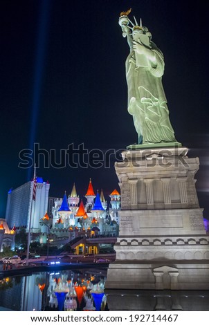 LAS VEGAS - MAY 12: The Excalibur Hotel and Casino and a model of the Statue of Liberty in Las Vegas on May 12, 2014 , The Hotel was named after King Arthur\'s sword and opened in 1990