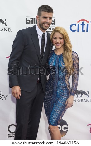 LAS VEGAS - MAY 18 : Soccer player Gerard Pique (L) and recording artist Shakira attends the 2014 Billboard Music Awards at the MGM Grand Garden Arena on May 18 , 2014 in Las Vegas.
