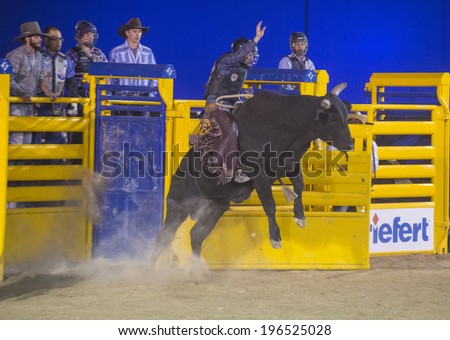 LAS VEGAS - MAY 16 : Cowboy Participating in a Bull riding Competition at the Helldorado days Rodeo , A professional Rodeo held in Las Vegas on May 16 , 2014
