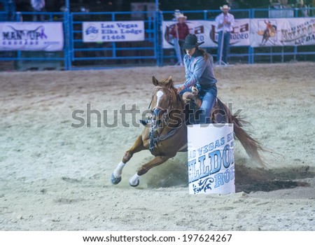 LAS VEGAS - MAY 16 : Cowgirl Participating in a Barrel racing competition at the Helldorado Days Rodeo , A professional rodeo held in Las Vegas , Nevada on May 16 2014