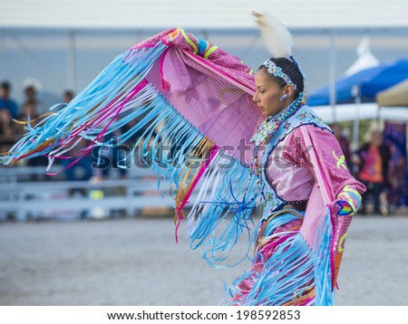 LAS VEGAS - MAY 24 : Native American woman takes part at the 25th Annual Paiute Tribe Pow Wow on May 24 , 2014 in Las Vegas Nevada. Pow wow is native American cultural gathernig event.