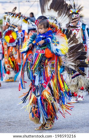 LAS VEGAS - MAY 24 : Native American men takes part at the 25th Annual Paiute Tribe Pow Wow on May 24 , 2014 in Las Vegas Nevada. Pow wow is native American cultural gathernig event.