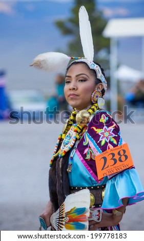 LAS VEGAS - MAY 24 : Native American woman takes part at the 25th Annual Paiute Tribe Pow Wow on May 24 , 2014 in Las Vegas Nevada. Pow wow is native American cultural gathernig event.