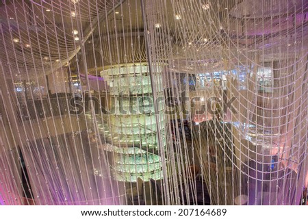 LAS VEGAS - July 21 : The Chandelier Bar at the Cosmopolitan Hotel & Casino in Las Vegas on July 21 2014. This tri-level chandelier encases the hotels 3 bars in illuminated crystals.