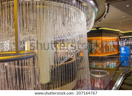 LAS VEGAS - JULY 21 : The Chandelier Bar at the Cosmopolitan Hotel & Casino in Las Vegas on July 21 2014. This tri-level chandelier encases the hotels 3 bars in illuminated crystals.