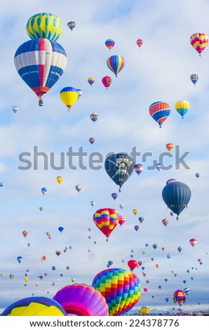ALBUQUERQUE, NEW MEXICO - OCT 11: Balloons fly over Albuquerque on October 11, 2014 in Albuquerque, New Mexico. Albuquerque balloon fiesta is the biggest balloon event in the world.
