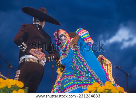 COACHELLA , CALIFORNIA - NOV 01 : Traditional Mexican dancers perform at the Dia De Los Muertos celebration in Coachella , California on November 01 2014