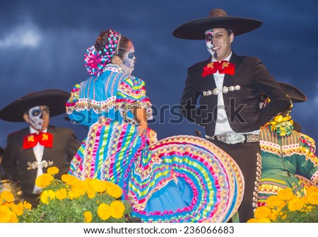 COACHELLA , CALIFORNIA - NOV 01 : Traditional Mexican dancers perform at the Dia De Los Muertos celebration in Coachella , California on November 01 2014