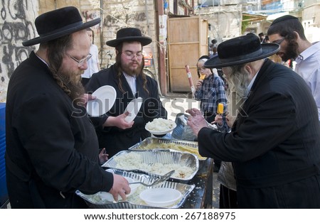 JERUSALEM - APRIL 05 : An Ultra Orthodox Jews handing out food to the poor in Jerusalem Israel on April 05 2012 providing food to the poor is one of the customs of Passover