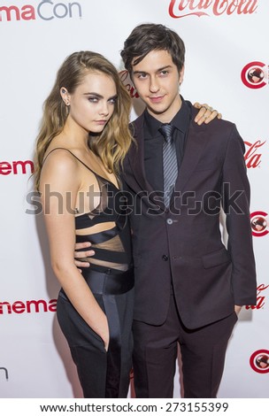 LAS VEGAS - APR 23 : Actors Cara Delevingne (L) and Nat Wolff, winners of CinemaCon\'s Rising Stars of the year award, attends the 2015 Big Screen Achievement Awards on April 23 2015 in Las Vegas
