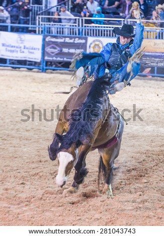 LAS VEGAS - MAY 16 : Cowboy Participating in a Bucking Horse Competition at the Helldorado days Rodeo , A Professional Rodeo held in Las Vegas on May 16 2015