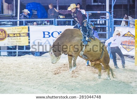 LAS VEGAS - MAY 16 : Cowboy Participating in a Bull riding Competition at the Helldorado days Rodeo , A professional Rodeo held in Las Vegas , Nevada on May 16 , 2015