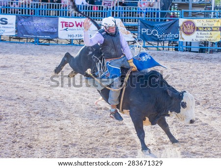LAS VEGAS - MAY 17 : Cowboy Participating in a Bull riding Competition at the Helldorado days Rodeo , A professional Rodeo held in Las Vegas , Nevada on May 17 , 2015