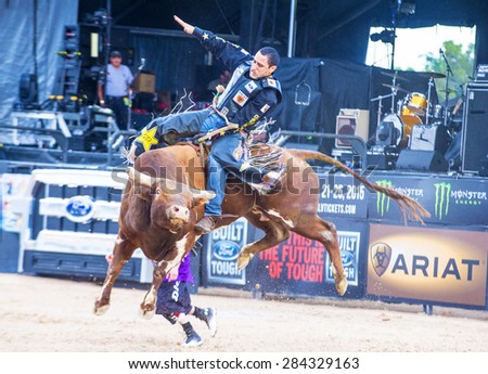 LAS VEGAS - MAY 23 : Number one Bull rider in the world  Joao Ricardo Vieira Participating in a Bull riding Competition at the Las Cowboy Standing , a PBR cometition held in Las Vegas on May 23 2015