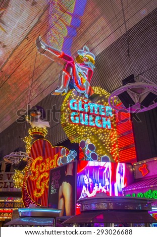 LAS VEGAS - MAY 17 : Cowgirl neon sign in downtown Las Vegas on May 17 2015. The iconic sign of Glitter Gulch is placed in 20 East Fremont Street, in Downtown Las Vegas