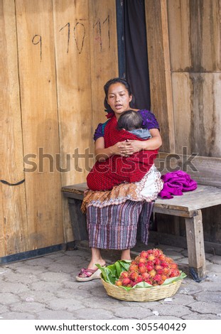 CHICHICASTENANGO , GUATEMALA - JULY 26 : Guatemalan woman Sells fruits at the Chichicastenango Market on July 26 2015. This native market is the most colorful in Central America