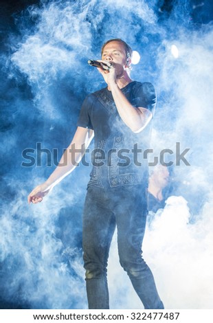 LAS VEGAS - SEP 26 : Dan Reynolds of Imagine Dragons performs on stage at the 2015 Life is Beautiful festival on September 26, 2015 in Las Vegas, Nevada.