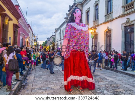 OAXACA , MEXICO  - NOV 02 : Mojiganga at the carnival of the Day of the Dead in Oaxaca, Mexico, on November 02 2015. Mojigangas are traditional Mexican giant puppets.