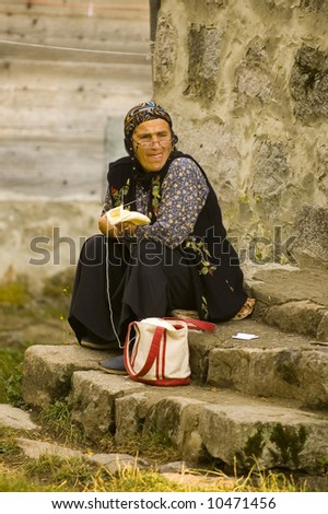 Turkish old woman knitting outside her house in Ankara