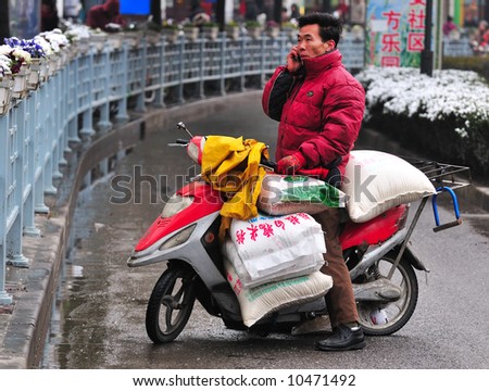 Chinese motorcyclist in shanghai street