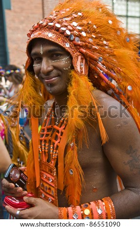 NEW YORK -  JUNE 26 : An unidentified participant celebrates  in a gay pride parade after passing the same sex marriage bill in New York City on June 26, 2011.