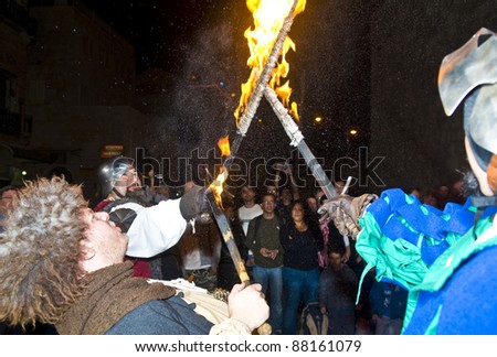 JERUSALEM - NOV 03 : An Italian actors dresses as knights and fight with swords and fire in the annual medieval style knight festival held in the old city of Jerusalem on November 03, 2011