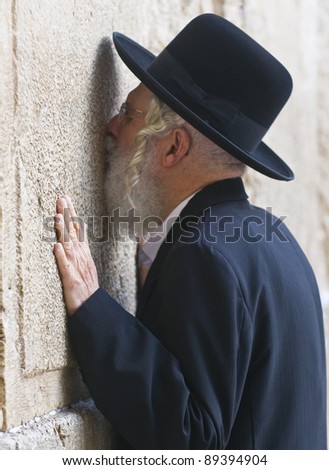 JERUSALEM - NOVEMBER 03 2011 - Orthodox jewish man prays in The western wall  , An Important Jewish religious site located in the Old City of Jerusalem , Israel, 11.3.2011