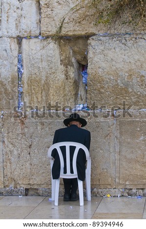 Orthodox Jew prays in the Westren wall an Important Jewish religious site located in the Old City of Jerusalem