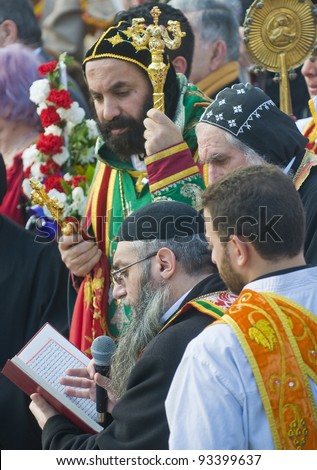 QASER EL YAHUD , ISRAEL - JAN 19 : Syrian Orthodox priests participates in the annual baptising ceremony during the epiphany at Qaser el yahud , Israel in January 19 2012