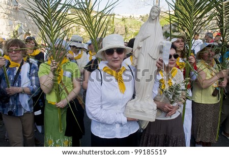 JERUSALEM - APRIL 01 : Christian Pilgrims take part in the Palm sunday procession in Jerusalem on April 01 2012