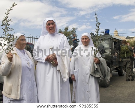 JERUSALEM - APRIL 01 : Unidentified nuns take part in the Palm sunday procession in Jerusalem on April 01 2012