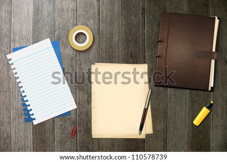 Book, office papers and pen