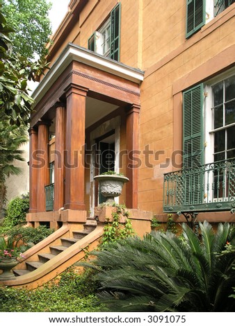 Historic house with windows, porch and steps